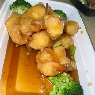 a plate of broccoli and shrimp