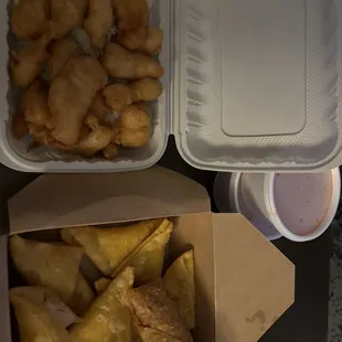 Sweet-and-sour chicken with white rice, crab raccoons, and an eggroll