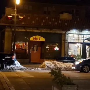 cars parked in front of the restaurant