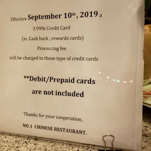 a sign stating that the restaurant is open