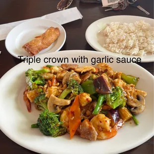 Triple Crown in Garlic Sauce, white rice and eggroll.