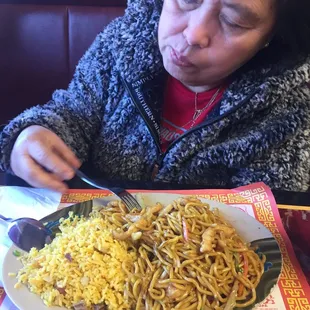 Mama eating chicken Lo mein. I told her she wasn&apos;t in the pic.