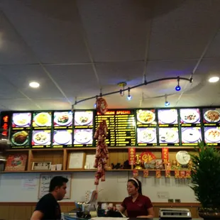 two people sitting at the counter