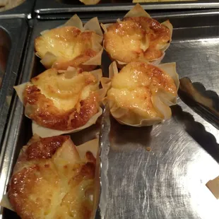 a variety of pastries on a metal tray