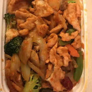  a chicken and broccoli dish in a styrofoam container
