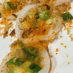 45. Banh Beo. Steamed rice cakes with fried onion, green onion and dried shrimp powder served with nuoc cham for dipping.