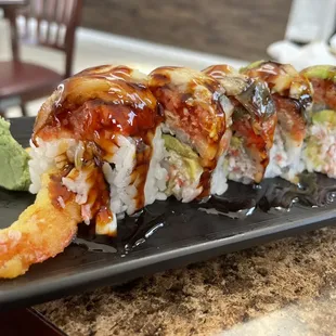 Red Dragon Roll. Has shrimp tempura, spicy tuna and Eel. Best of everything!