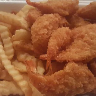 Fired shrimp and fries combo. $5.45 Comes with 15 shrimp. No seasoning whatsoever, but get you some tarter sauce and you&apos;ll be alright.