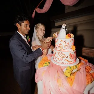 cutting cake on the decl