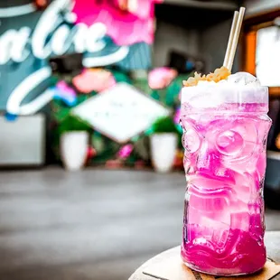 a pink drink on a table