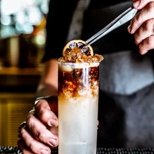 a bartender mixing a drink