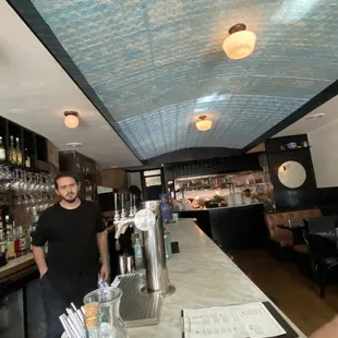 a man standing at a bar