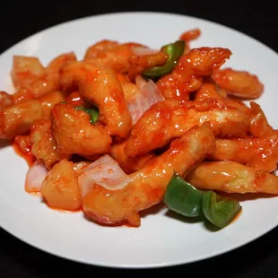  a plate of shrimp with sauce