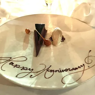 a white plate with a chocolate dessert on it