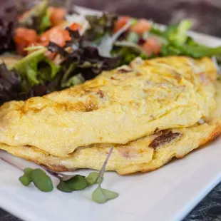 an omelet with a side salad