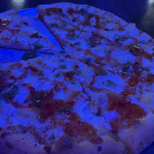 a pizza on a blue plate