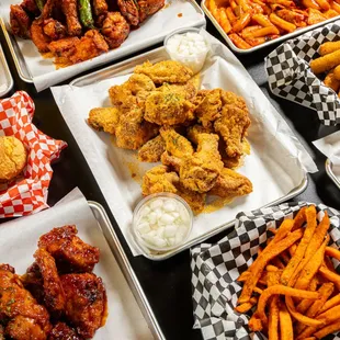 a variety of wings and fries