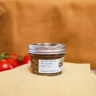 a jar of sauce on a napkin