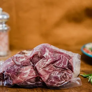 a bunch of meat wrapped in plastic