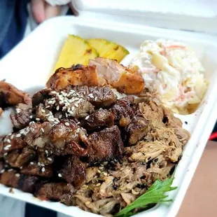 a person holding a tray of food