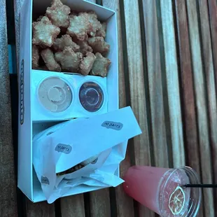 Burger and tots and absinthe drink