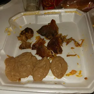 Hard meat clumps and runny refried beans