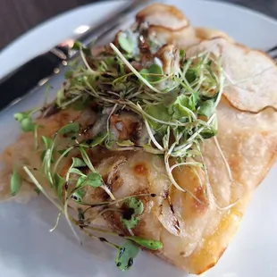 Close up of Pear slice with blue cheese chunks, Balsamic glaze &amp; EVOO