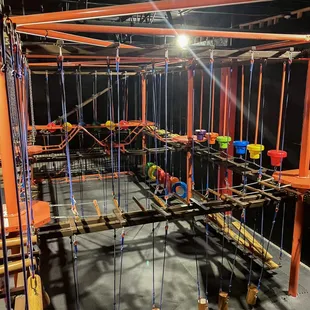 an indoor play area with ropes and ropes