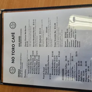 a menu on a wooden table