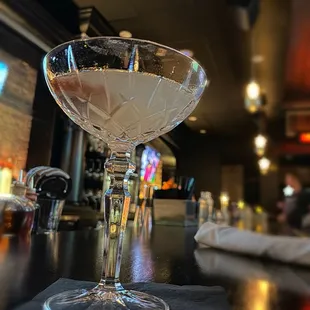 a martini glass on a bar