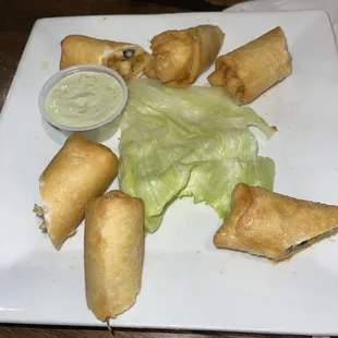 Chicken egg rolls with avocado ranch dipping sauce