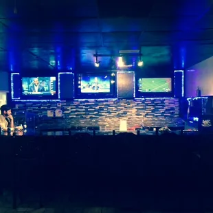 a woman sitting at a bar