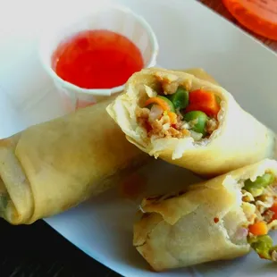 Lumpia -- seasoned soy ground beef mixed with shredded cabbage, peas, carrots, rolled in eggless rice wrapper and deep fried.
