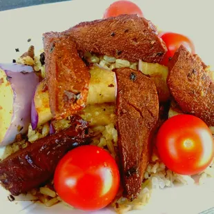 Adobo -- crispy fried soy chicken strips, soft eggplant, all cooked in marinade with soy sauce, vinegar, garlic.