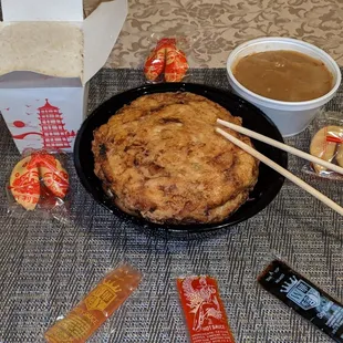 a bowl of food and chopsticks
