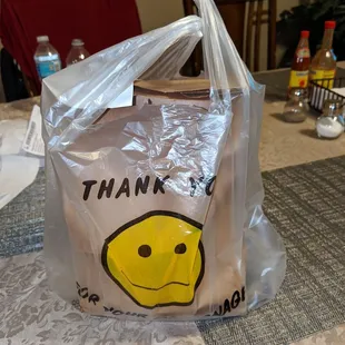 a plastic bag with a smiley face on it