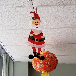 a santa clause hanging from the ceiling