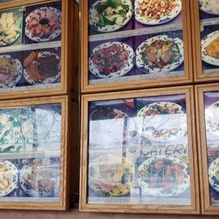 a wall of plates of food
