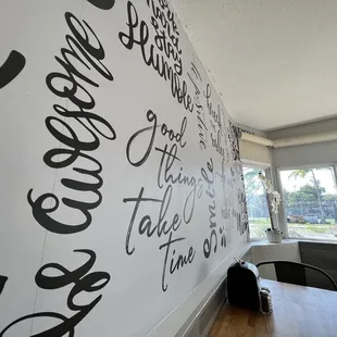 a wall with writing on it