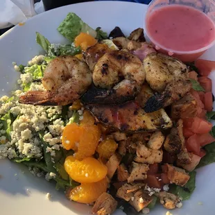 Chopped salad with grilled chicken, shrimp &amp; pineapple, mandarin oranges, blue cheese &amp; a raspberry vinaigrette dressing.