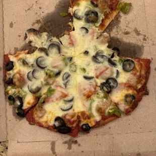 Gluten free thin with sausage, pepperoni, onion, green pepper.