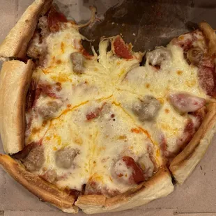 Pan pizza with sausage and pepperoni.