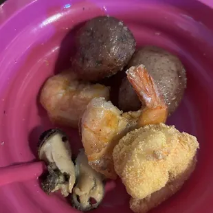 Fried shrimp , shrimp , mussels and potatoes with garlic butter