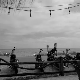 a black and white photo of a group of bikers