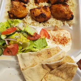 Chicken Kabab with rice, sald, garlic sauce. Definitely 2-3 meals here!