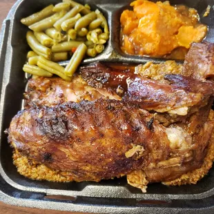 a tray of meat and green beans