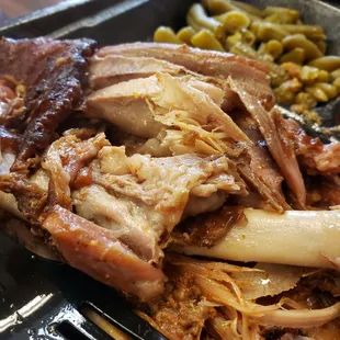 a plate of pulled pork and beans