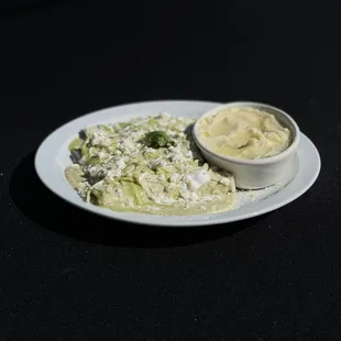 Enchiladas Suizas served with chicken or cheese. and your choice of two sides.