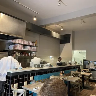 Sit inside and watch the cooks and enjoy the aroma.