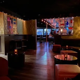 the interior of a bar with leather furniture
